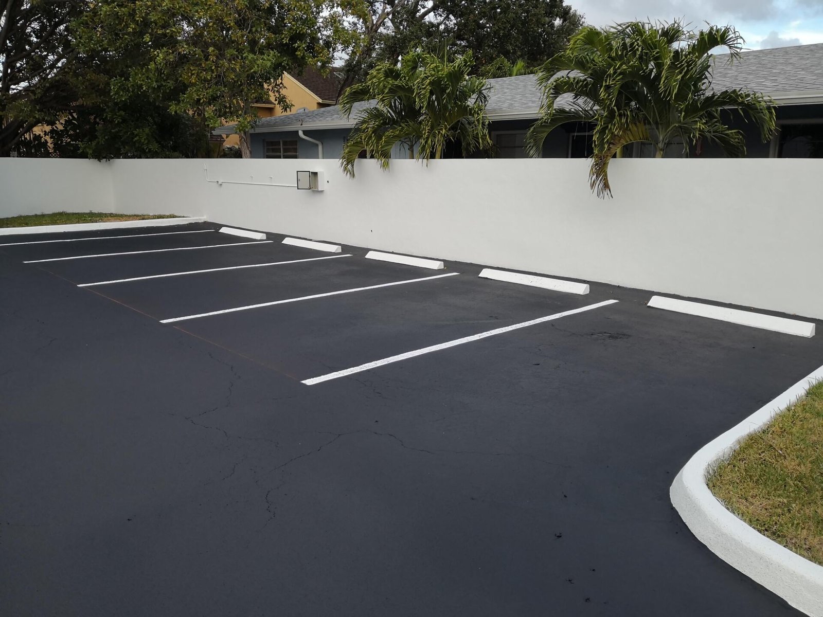 freshly resealed asphalt parking lot in Naples FL