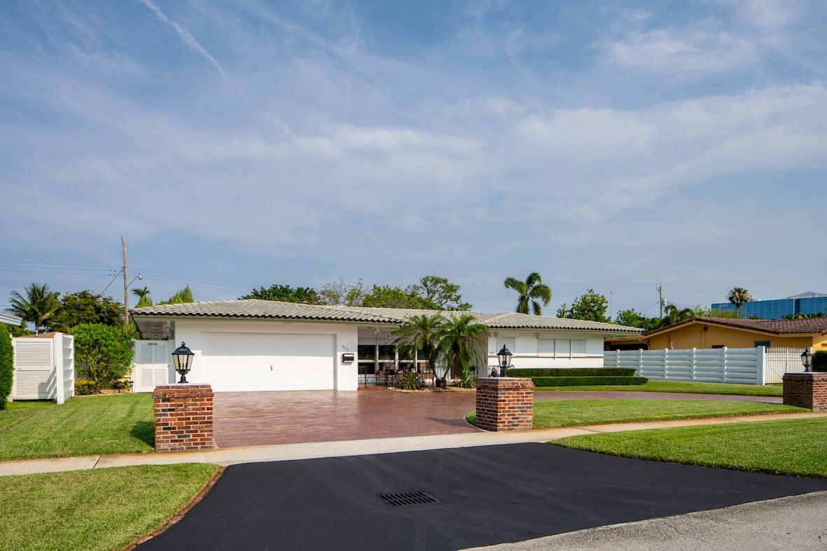 a protective sealant is applied to this driveway in Naples FL to help extend its lifespan