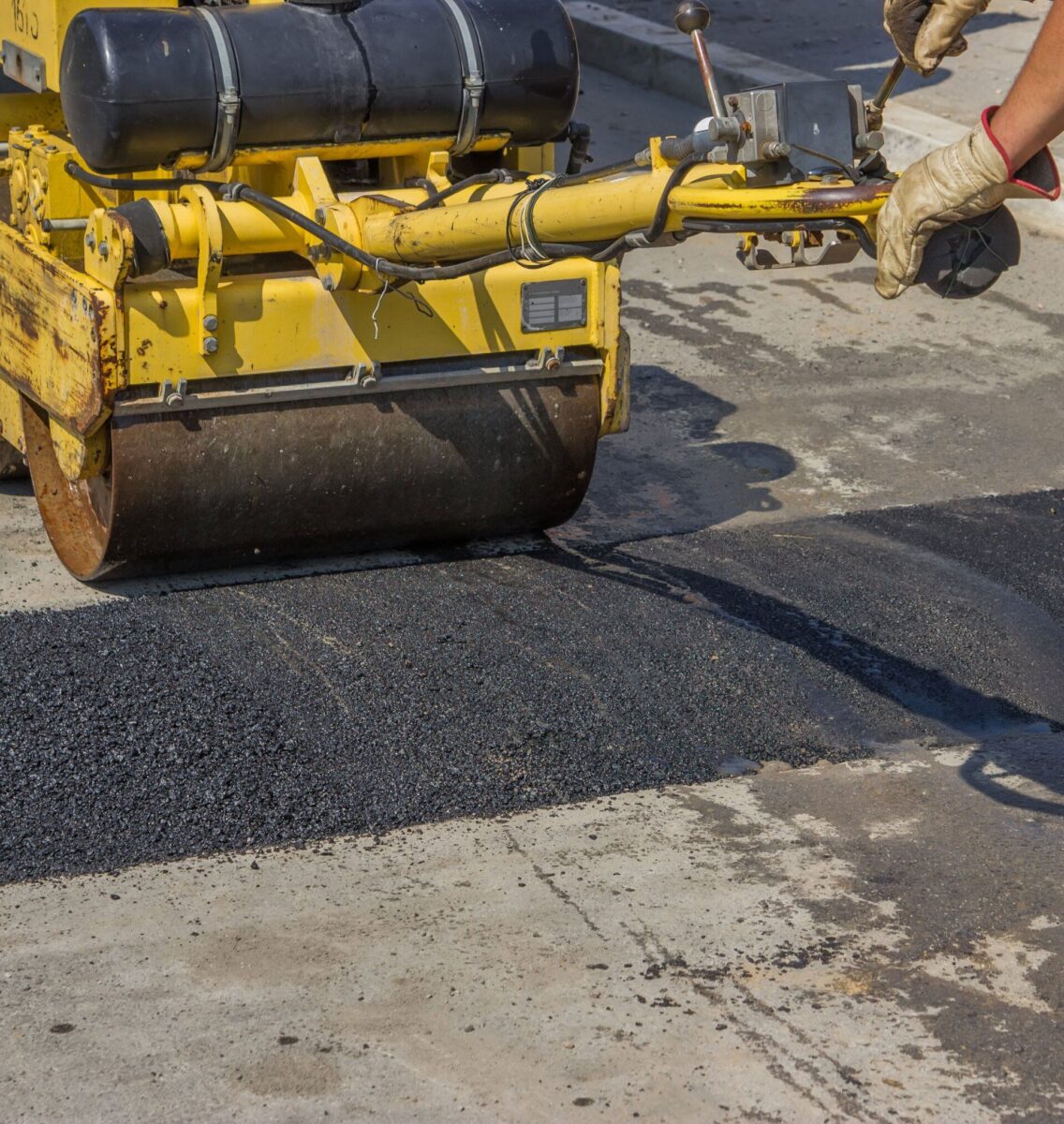 paver performing an Asphalt Patch repair in Miami